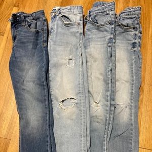 Four pair of boys size 8 skinny jeans.
